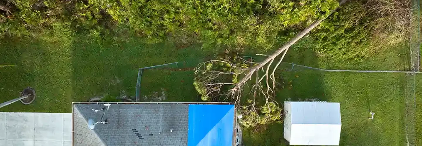 hurricane-ian-damaged-house-rooftop-covered-with-p-2024-12-07-03-59-46-utc